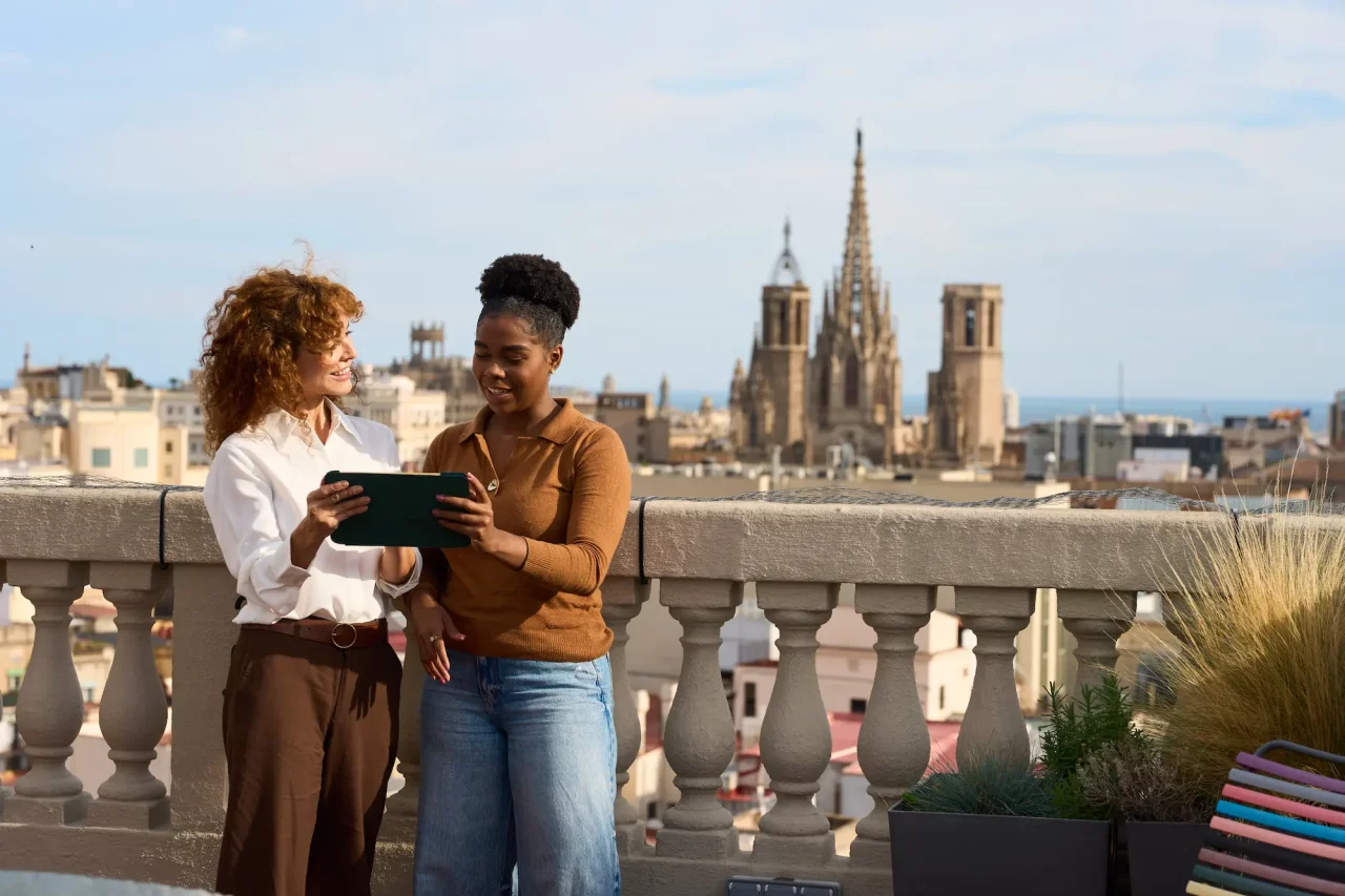 coworkers-discussing-business-on-barcelona-rooftop-2025-12-07-17-22-12-utc